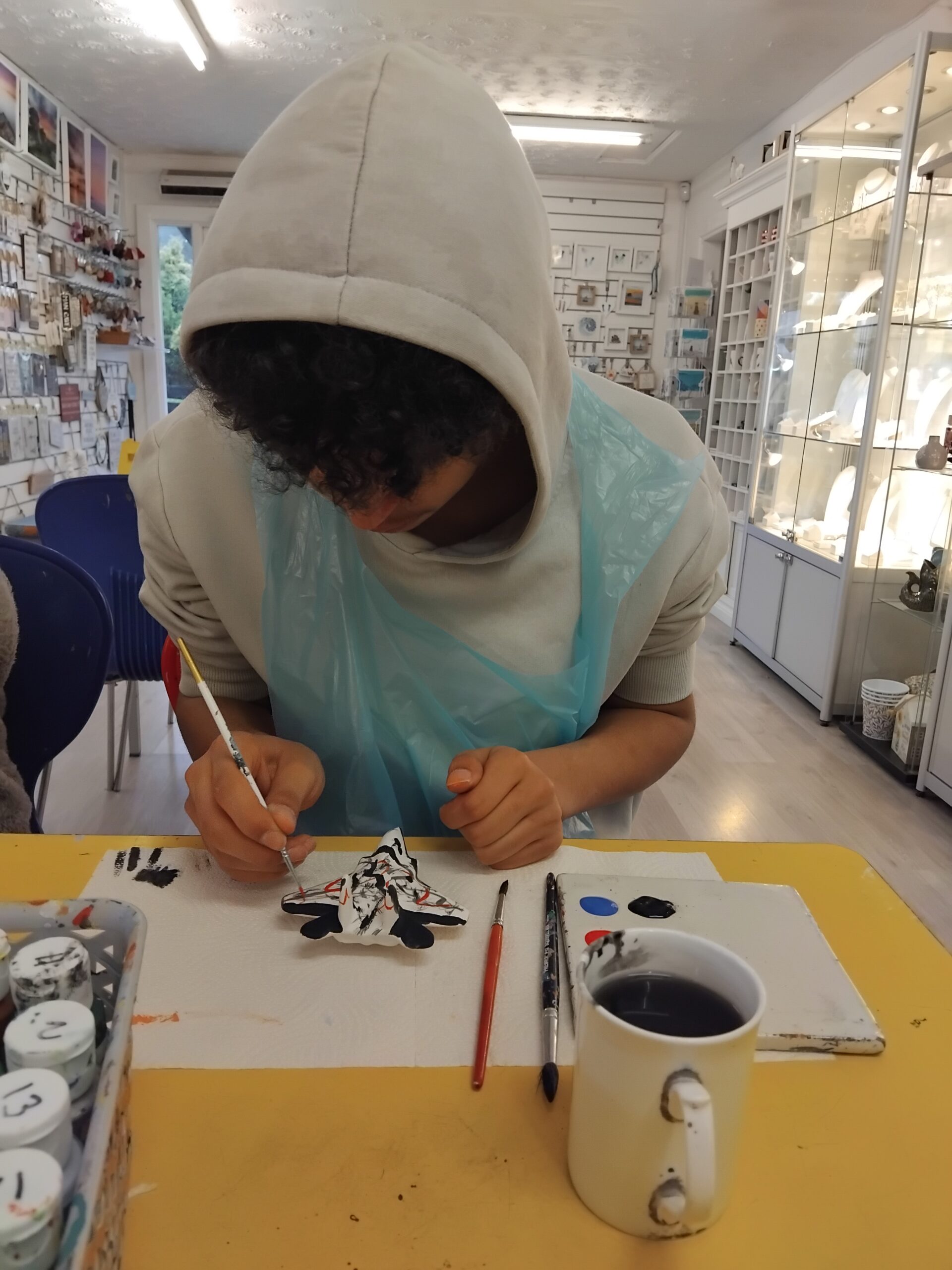 Learners from Three Bridges School creating ceramic artwork during a hands-on pottery session at Cornwall Gold in Truro.
